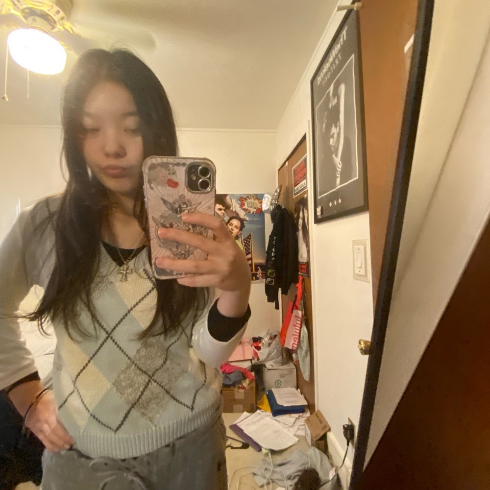White and blue patterned sweater vest